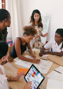 Photo of Women at the Meeting reviewing reading Hustle & Pivot's latest trends and insights she signed up for